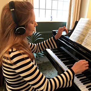 Sarah Beth Briggs recording a video in her music room at home during lockdown